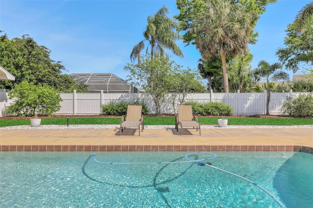 view of swimming pool with a fenced in pool, a patio, and a fenced backyard