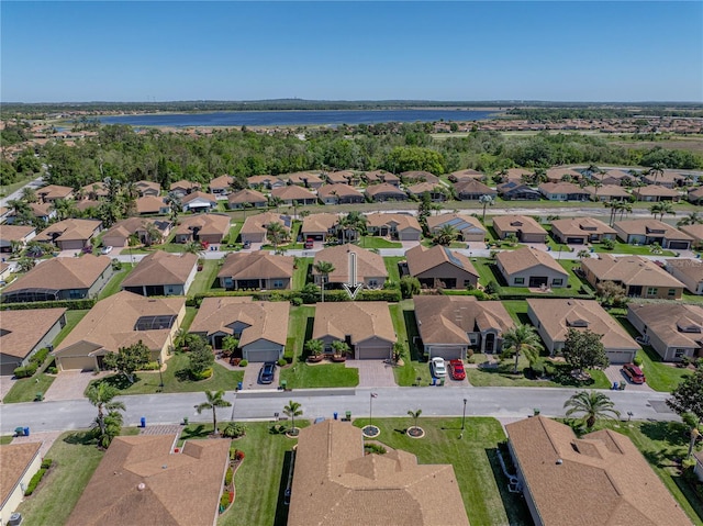birds eye view of property featuring a residential view and a water view