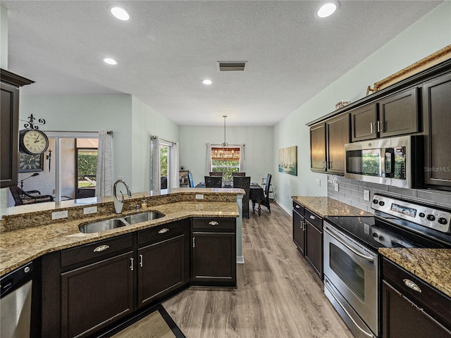 kitchen with visible vents, a sink, plenty of natural light, and appliances with stainless steel finishes