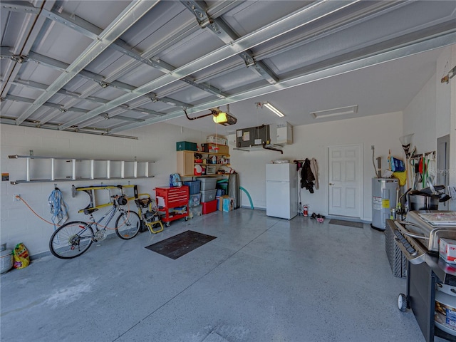 garage with water heater, a garage door opener, and freestanding refrigerator