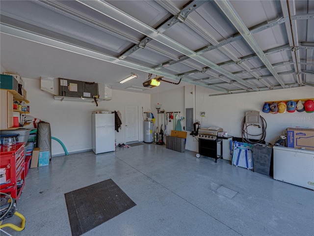 garage featuring water heater, a garage door opener, and freestanding refrigerator