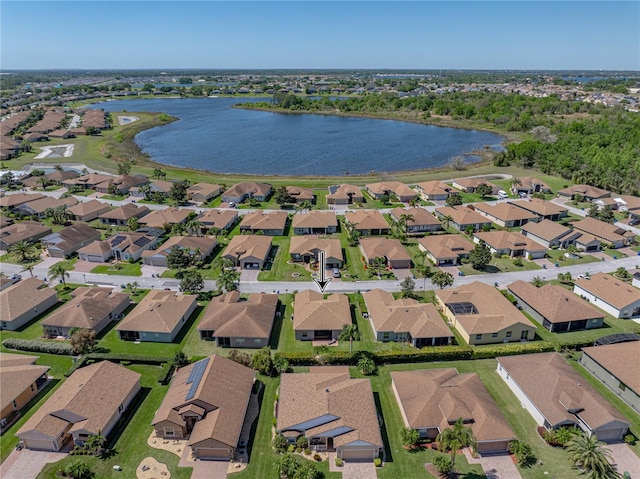 drone / aerial view with a water view and a residential view