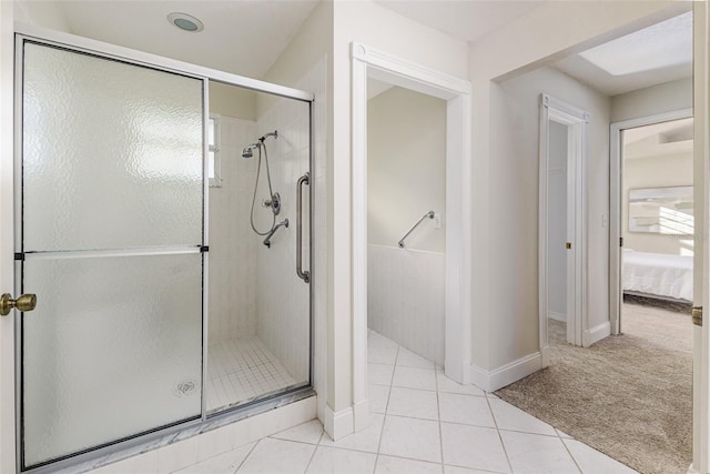 819 Seminole Rd, Babson Park, FL 33827 - ensuite bathroom featuring ensuite bath, tile patterned floors, and a shower stall