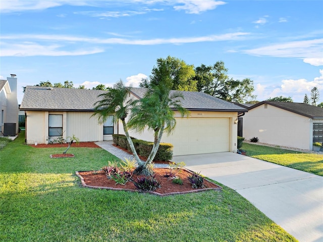 ranch-style home with a front yard, a garage, driveway, and stucco siding