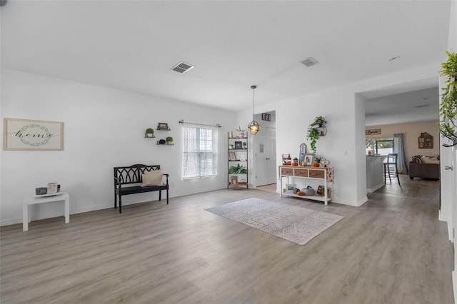 entryway featuring visible vents, light wood-type flooring, and baseboards