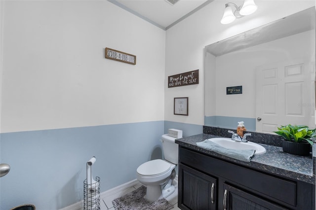 bathroom with tile patterned floors, visible vents, toilet, and vanity