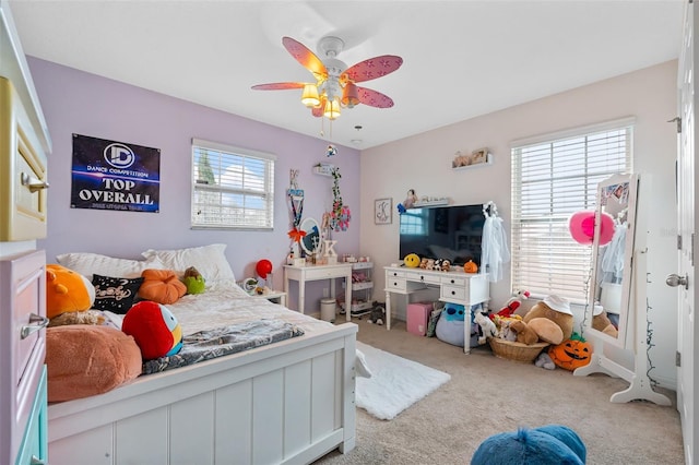 carpeted bedroom with a ceiling fan