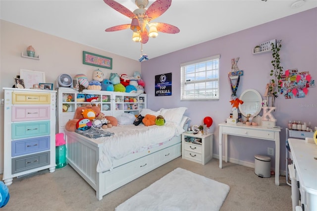 bedroom with light carpet, baseboards, and ceiling fan