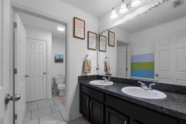 full bathroom featuring a sink, visible vents, toilet, and tile patterned flooring