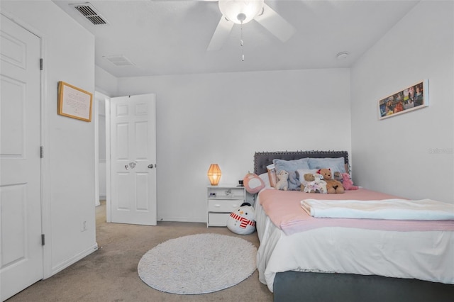 carpeted bedroom featuring visible vents and ceiling fan