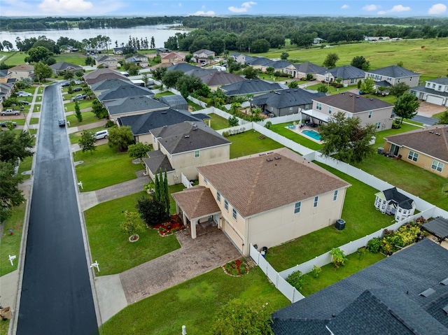 bird's eye view featuring a residential view and a water view