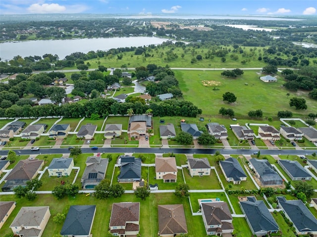 bird's eye view with a residential view and a water view