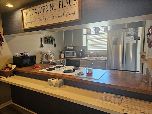 4529 Mercado Dr, Sebring, FL 33872 - kitchen featuring a sink, black appliances, and a toaster