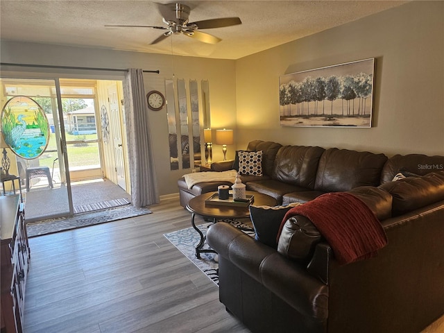 4529 Mercado Dr, Sebring, FL 33872 - living room with a textured ceiling, ceiling fan, and wood finished floors