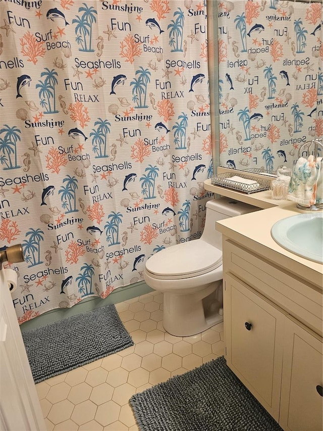 4529 Mercado Dr, Sebring, FL 33872 - full bathroom featuring toilet, tile patterned floors, and vanity