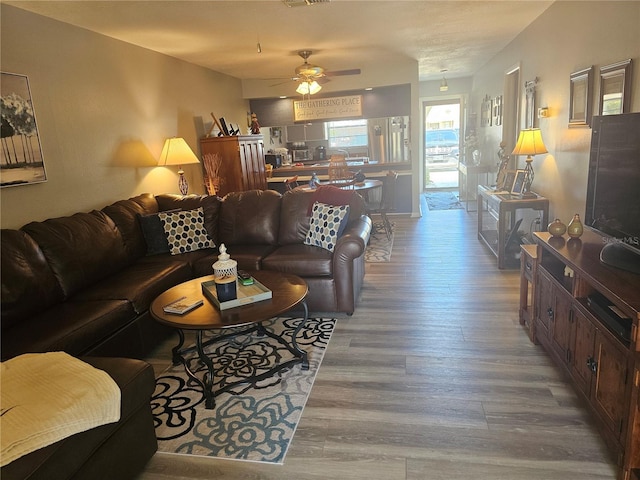 4529 Mercado Dr, Sebring, FL 33872 - living room with visible vents, wood finished floors, and a ceiling fan