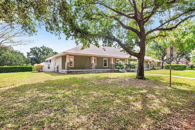5020 Broadmore Dr, Auburndale, FL 33823 - view of front of house featuring a front lawn and stone siding
