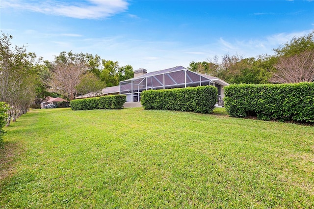 5020 Broadmore Dr, Auburndale, FL 33823 - view of grassy yard with a lanai