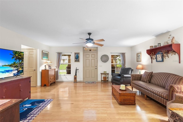 5020 Broadmore Dr, Auburndale, FL 33823 - living area featuring light wood-style floors and a ceiling fan