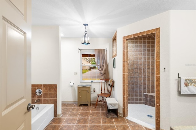 5020 Broadmore Dr, Auburndale, FL 33823 - full bathroom featuring a garden tub, a tile shower, vanity, tile patterned floors, and baseboards