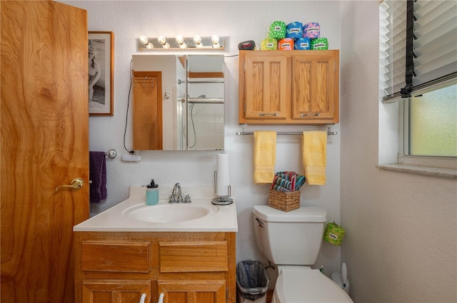 225 Wes Mann Rd, Babson Park, FL 33827 - bathroom with a shower with door, a textured wall, toilet, and vanity