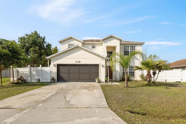 247 Cobalt Dr, Kissimmee, FL 34758 - traditional home with stucco siding, fence, a garage, driveway, and a front yard