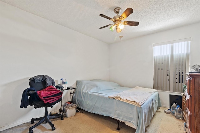 247 Cobalt Dr, Kissimmee, FL 34758 - carpeted bedroom featuring a textured ceiling and a ceiling fan