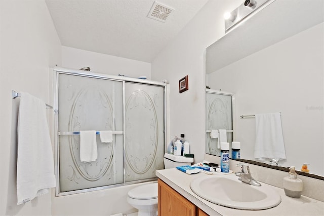 247 Cobalt Dr, Kissimmee, FL 34758 - bathroom with visible vents, bath / shower combo with glass door, toilet, and vanity