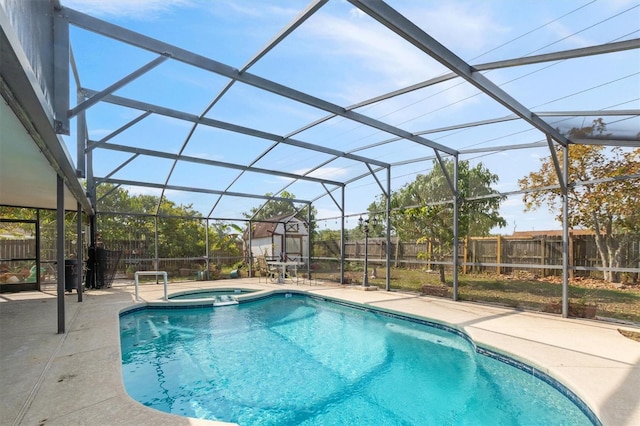 247 Cobalt Dr, Kissimmee, FL 34758 - view of swimming pool with glass enclosure, a fenced backyard, and a patio area