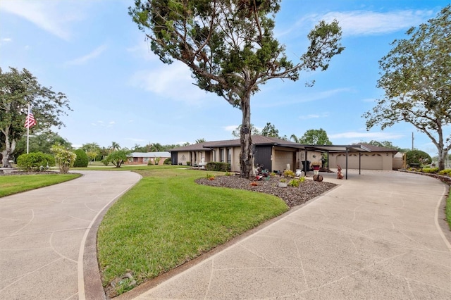mid-century inspired home featuring driveway, a front lawn, and an attached garage