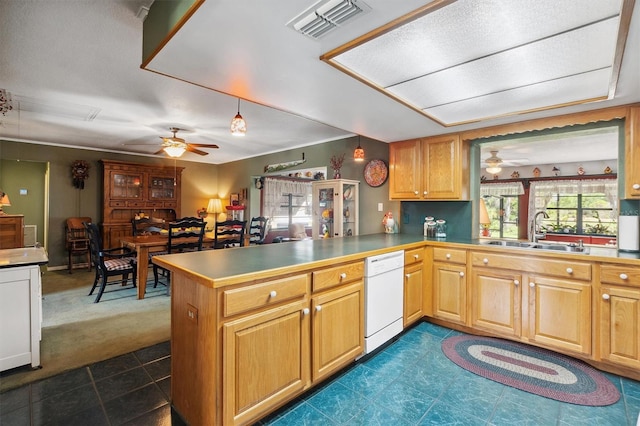 kitchen with a ceiling fan, a sink, white dishwasher, and visible vents