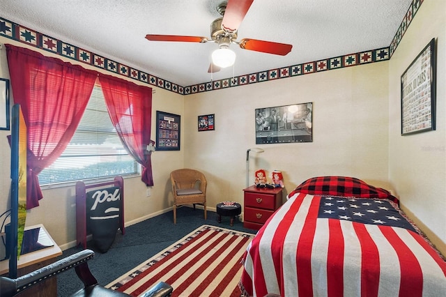 bedroom with baseboards, a ceiling fan, carpet floors, and a textured ceiling