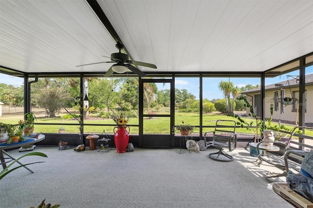 sunroom featuring a ceiling fan
