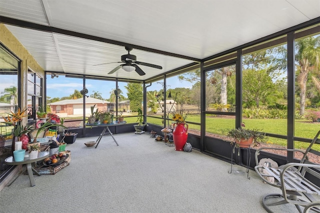 sunroom featuring ceiling fan