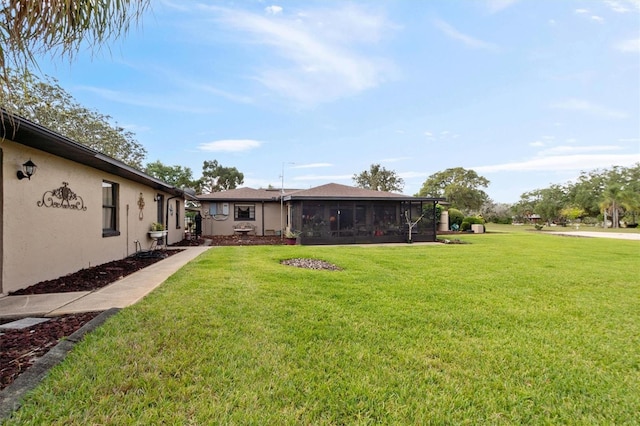 view of yard featuring a sunroom