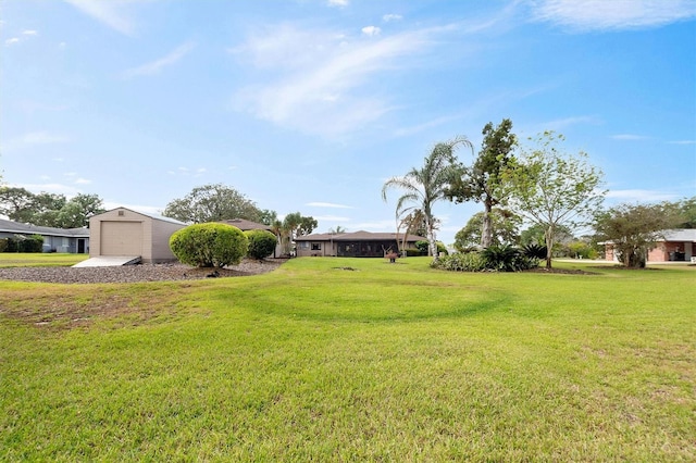 view of yard with gravel driveway