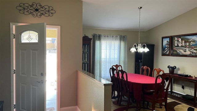 214 Brook Ln, Polk City, FL 33868 - dining area featuring a notable chandelier and lofted ceiling