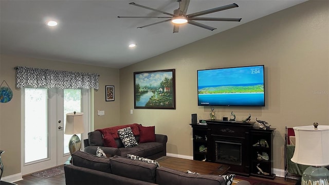 214 Brook Ln, Polk City, FL 33868 - living area with baseboards, a fireplace, a ceiling fan, lofted ceiling, and dark wood-style floors