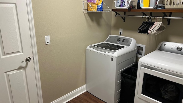 214 Brook Ln, Polk City, FL 33868 - clothes washing area featuring separate washer and dryer, baseboards, laundry area, and dark wood finished floors