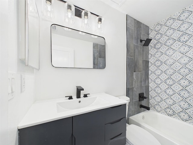 bathroom with toilet, vanity, and bathing tub / shower combination