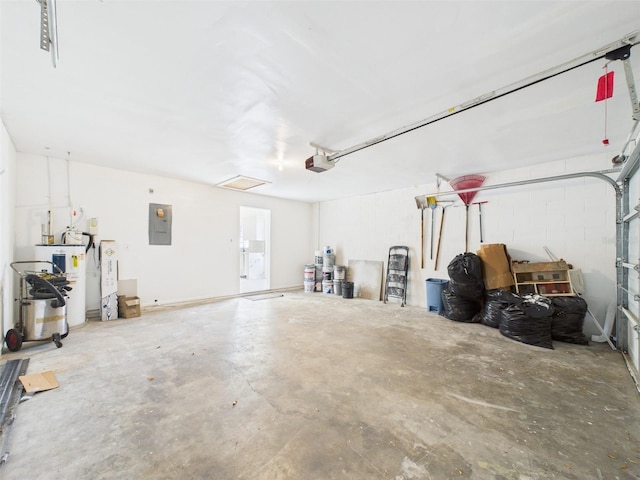 garage with water heater, a garage door opener, electric panel, and concrete block wall