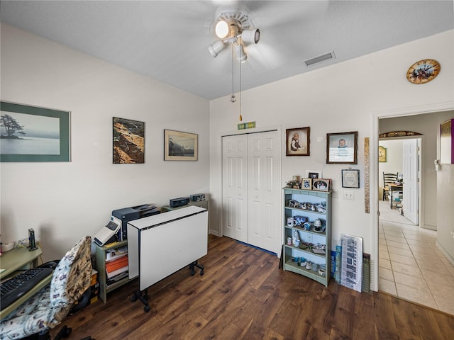 office featuring a ceiling fan, wood finished floors, and visible vents