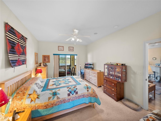 bedroom with ceiling fan, access to outside, and light carpet
