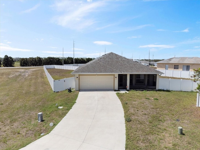 single story home featuring concrete driveway, fence, an attached garage, a front yard, and a shingled roof