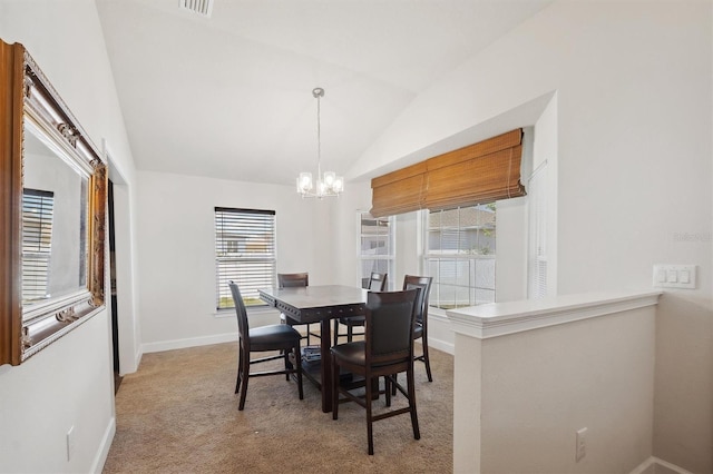 dining space with vaulted ceiling, light colored carpet, baseboards, visible vents, and a notable chandelier