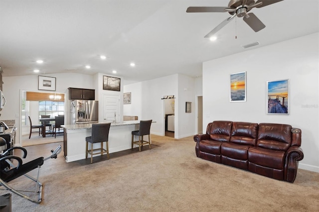 living area featuring vaulted ceiling, recessed lighting, light colored carpet, visible vents, and a ceiling fan