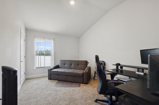 home office featuring carpet flooring, baseboards, and lofted ceiling