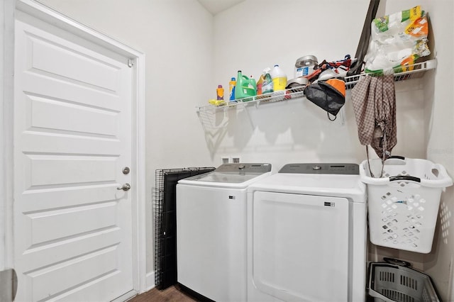 clothes washing area featuring laundry area and washer and clothes dryer