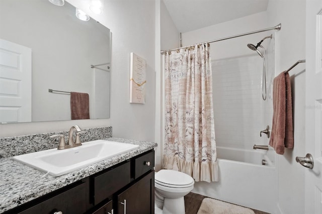 bathroom featuring toilet, shower / bath combination with curtain, and vanity