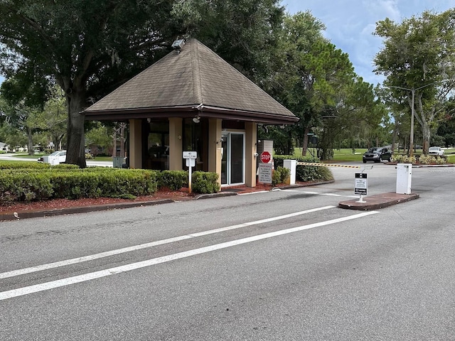 view of road with traffic signs and curbs